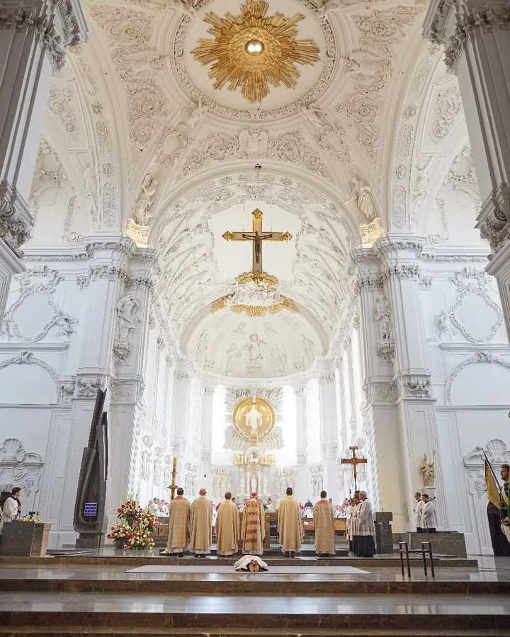 Deacon lying before the altar during an ordination ceremony by Andreas Düren