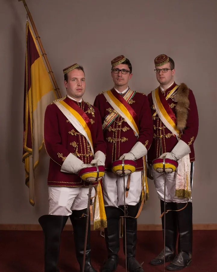 Formal portrait of three men in ceremonial uniforms by Andreas Düren