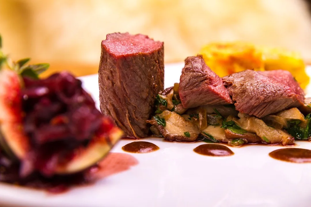 Plated venison with vegetables and sauce by Andreas Düren