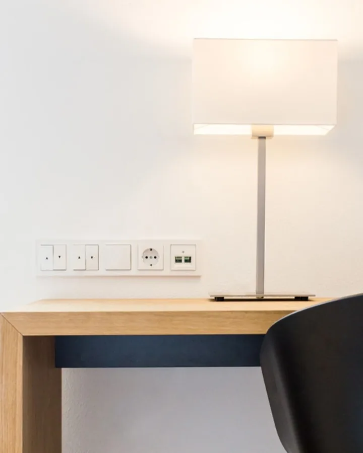 Minimal desk lamp and controls photographed for a fiber-optic supplier by Andreas Düren